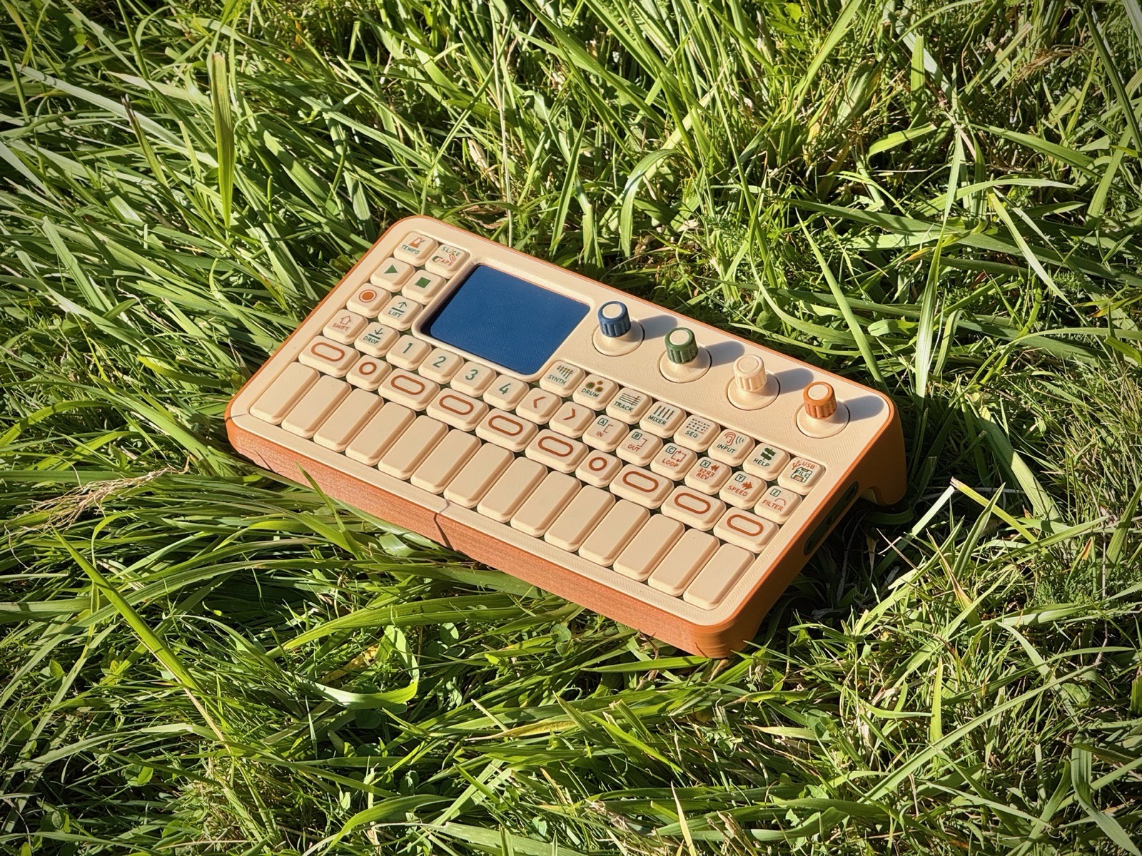 Look-alike model in grass, three-quarter view from the left, showing the orange-brown base and beige top