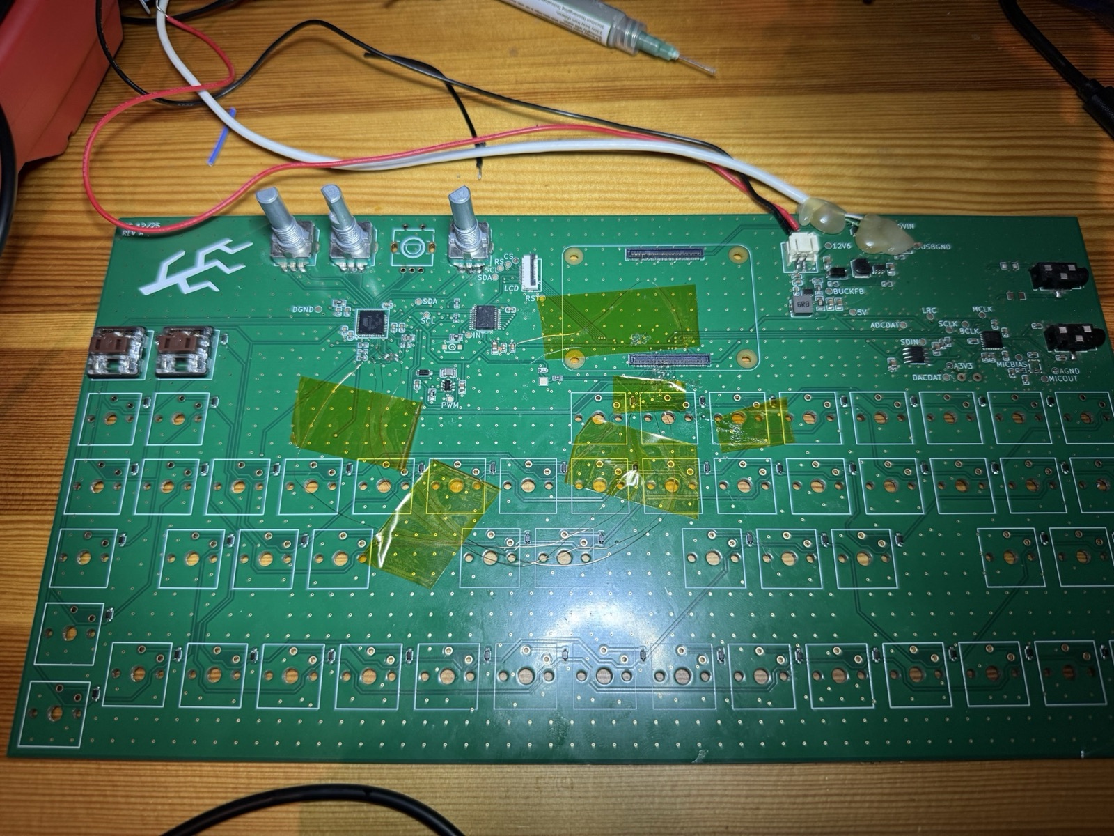 Validation board with tester key switches installed, red display wires, and the Compute Module mounted